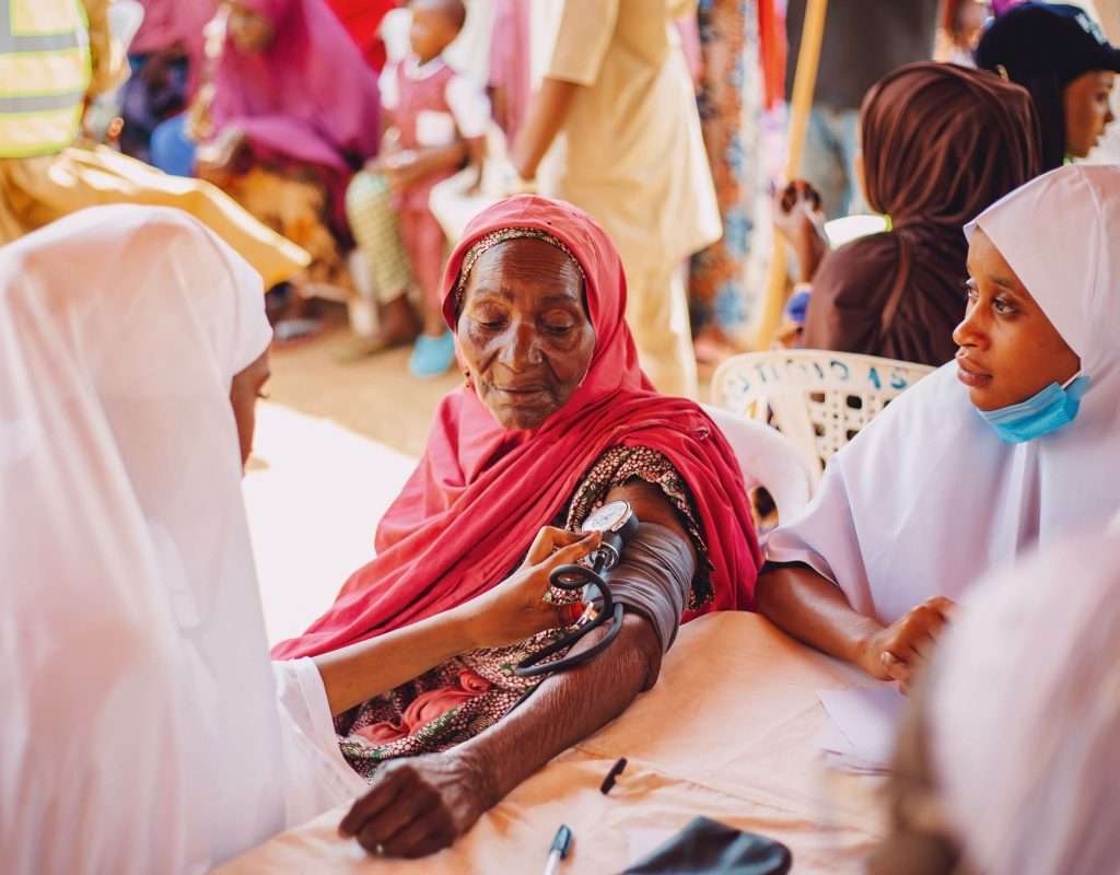 An outdoor health checkup during a community session