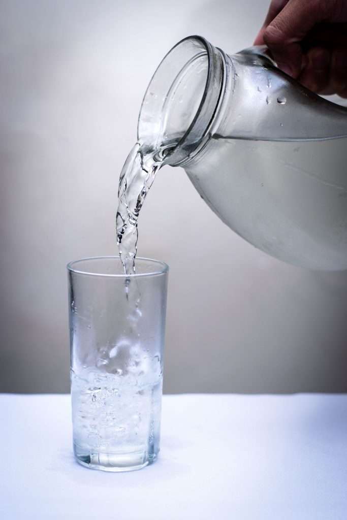 Clean water being poured, representing safe water access